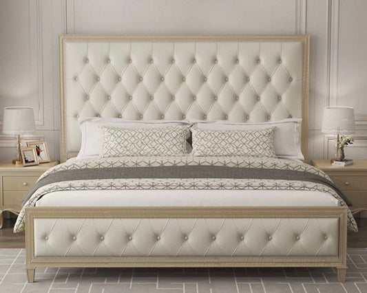 A tufted bed frame with beige upholstery and a wooden structure, featuring gold accents and a minimalist design.