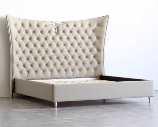 A modern luxury style tufted bed frame with a beige upholstered headboard and a wooden base, presumably made of mahogany wood, designed by Dainté Living.